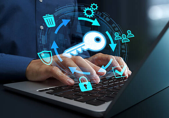 Businessperson using laptop computer for cryptographic operations.